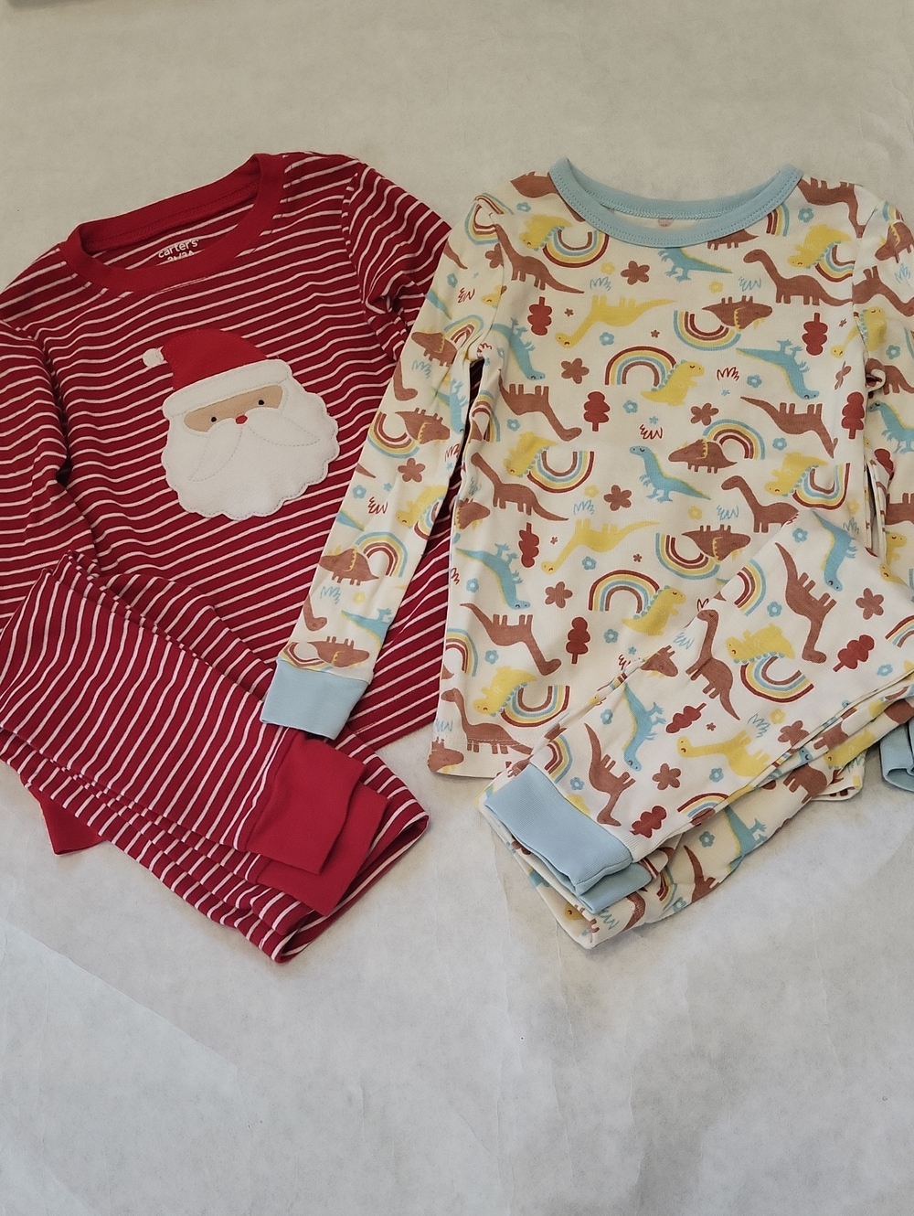 Two pair of snug fitting pajama sets